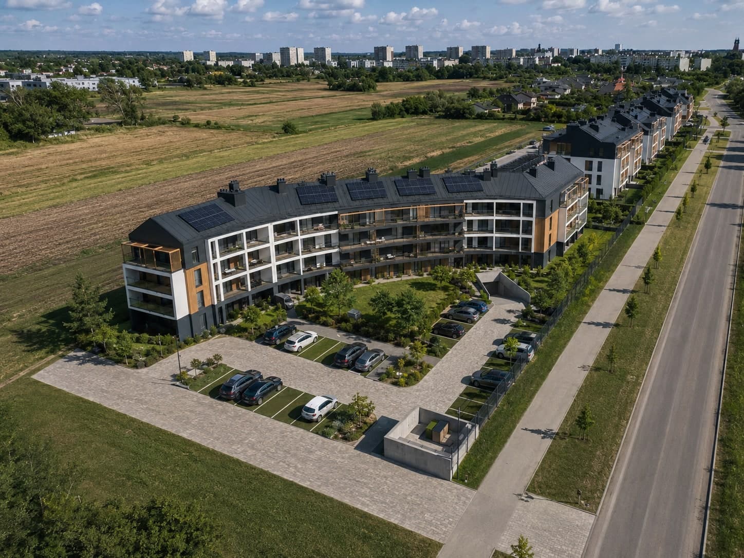Widok z lotu ptaka na osiedle Nowe Winiary w Gnieźnie, w tle miasto